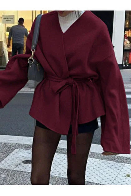 Blouse élégante à manches longues avec ceinture nouée